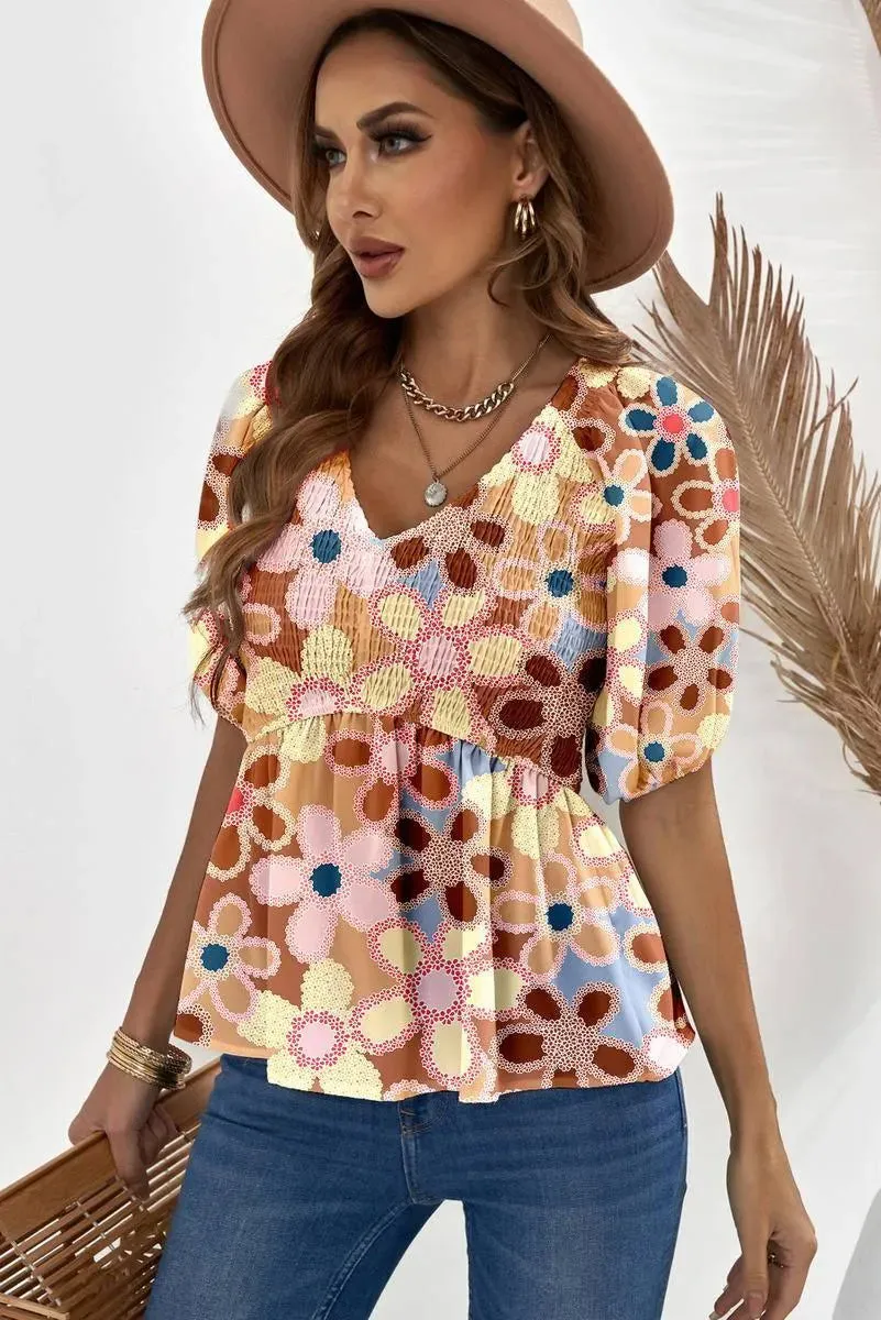Fall in love with our Flower Print Puff Sleeve Peplum Top - Shop Now!