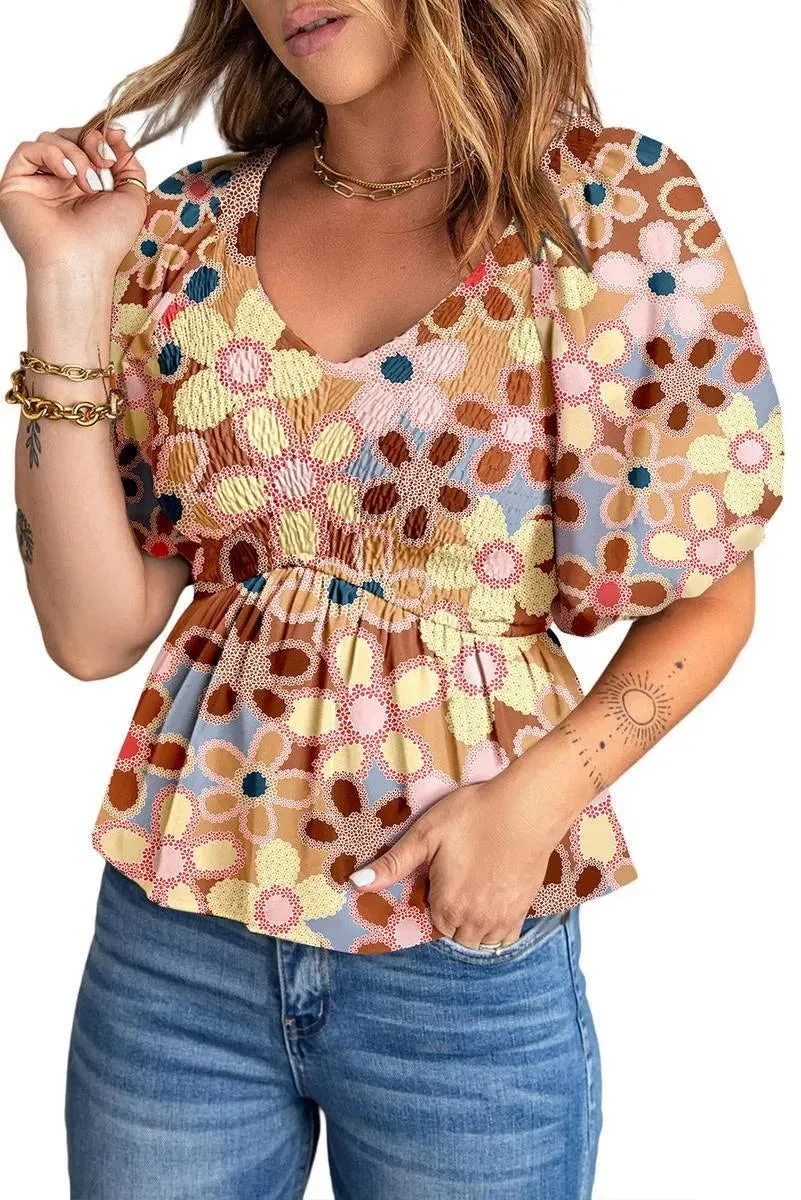 Fall in love with our Flower Print Puff Sleeve Peplum Top - Shop Now!