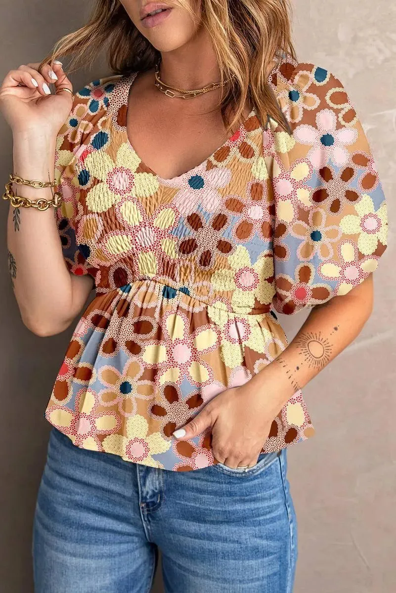 Fall in love with our Flower Print Puff Sleeve Peplum Top - Shop Now!